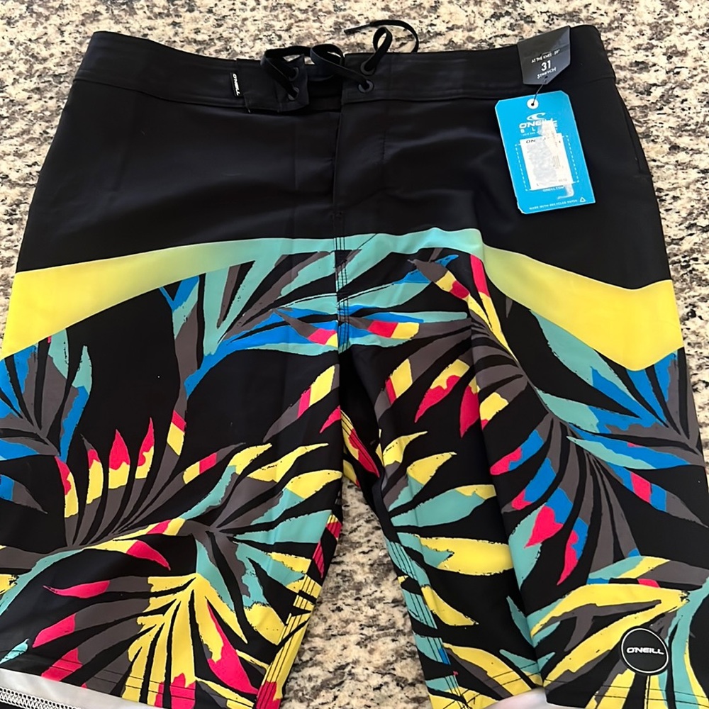 O’Neill black and multicolored 31 inch waist 20” length swim trunks NWT
